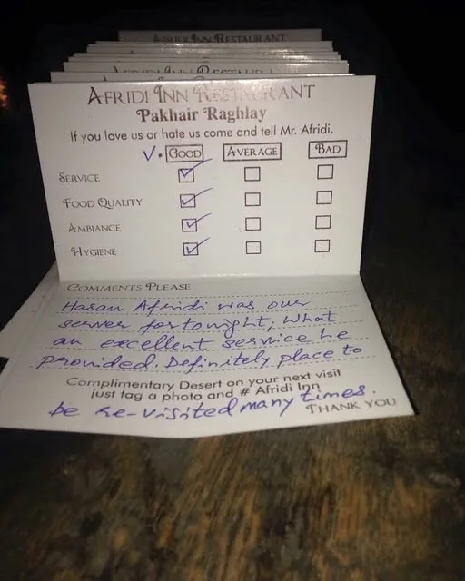 A real Pakhair Raghlay feedback card filled in by a guest